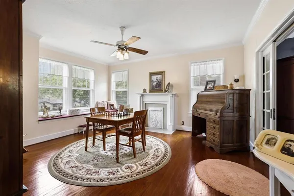 a living room with furniture a fireplace and a table