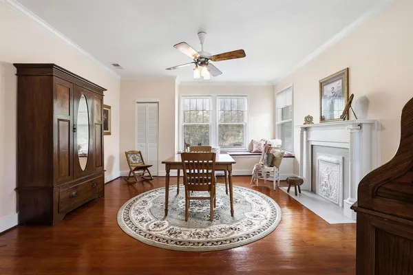 a living room with furniture a fireplace and a table