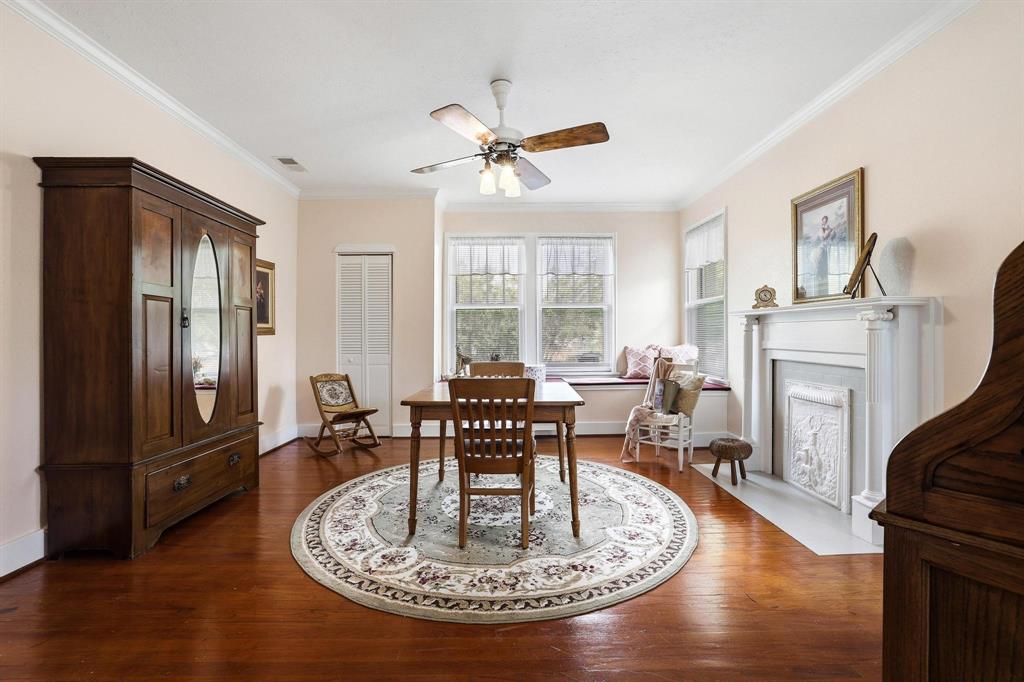 304 East 9th Street Bonham, TX 75418 - Photo 27 of 39 a living room with furniture a fireplace and a table