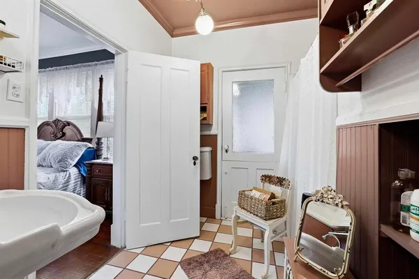 a room with furniture and a potted plant