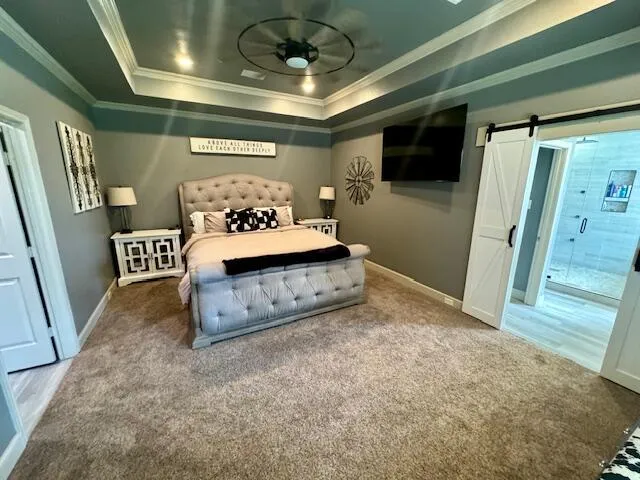 a bedroom with a large bed and a large window