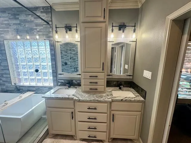 a bathroom with a shower and a sink