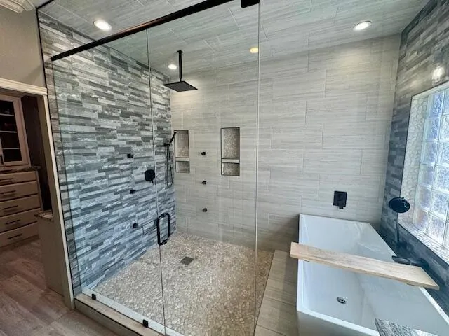 a bathroom with a tub sink and toilet