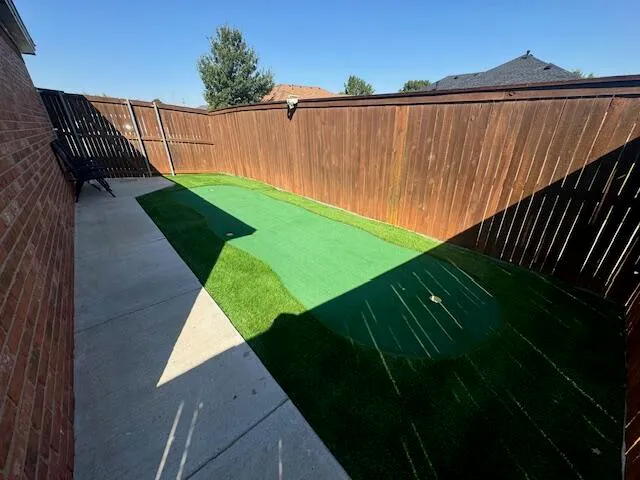 a patio with table and chairs