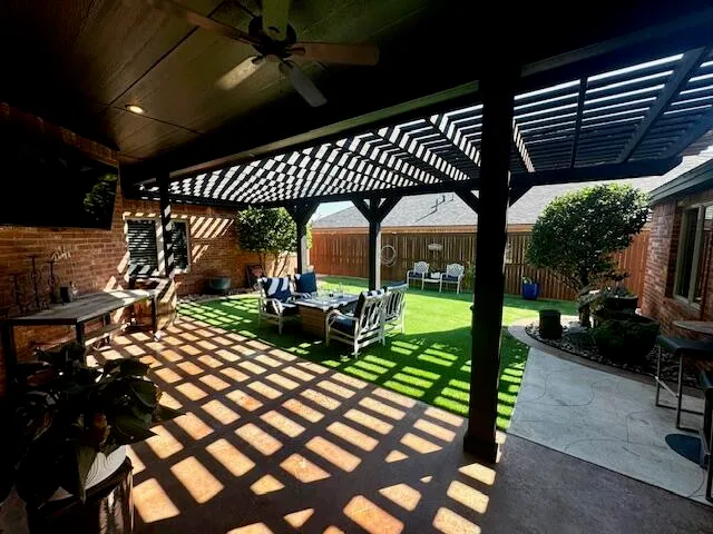 a outdoor living space with furniture and a garden