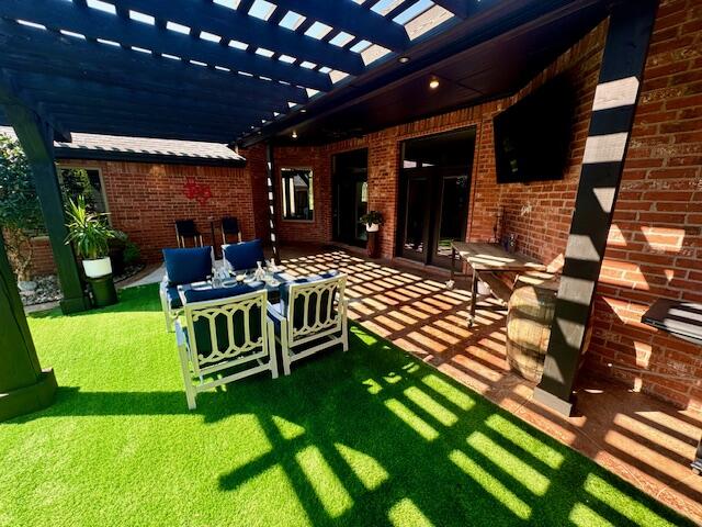 4028 125th Street Lubbock, TX 79423 - Photo 27 of 44 a outdoor living space with furniture and a garden