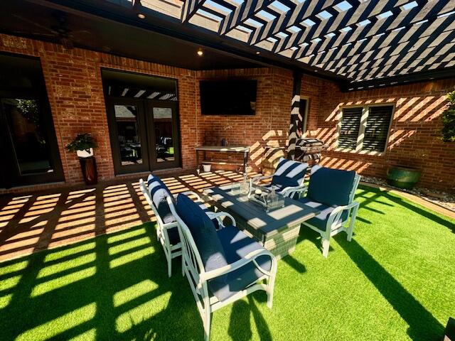 4028 125th Street Lubbock, TX 79423 - Photo 29 of 44 a view of an chairs and table in the patio