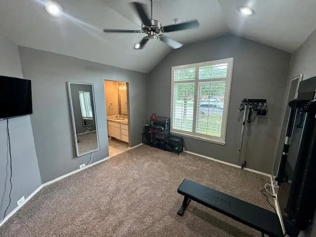 a bathroom with a granite countertop toilet sink and mirror