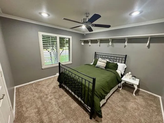 a white toilet sitting next to a window