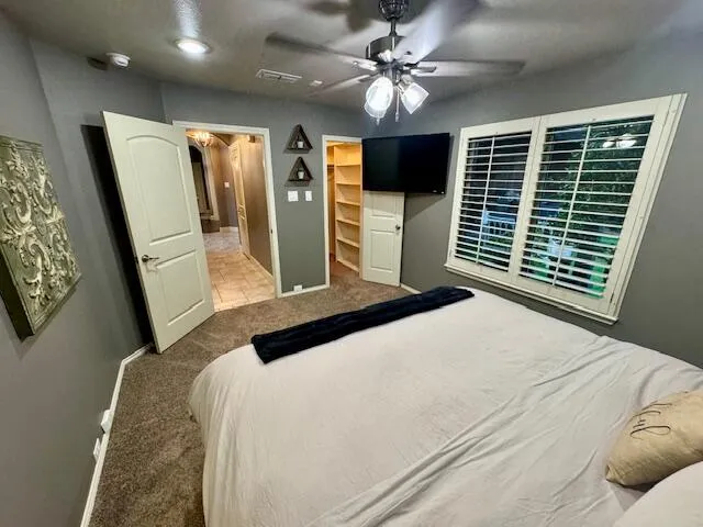 a view of a utility room with cabinets
