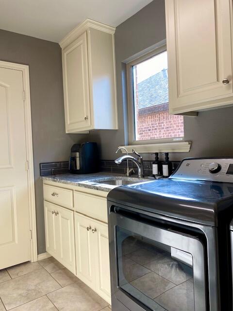 4028 125th Street Lubbock, TX 79423 - Photo 44 of 44 a kitchen with a stove and a sink