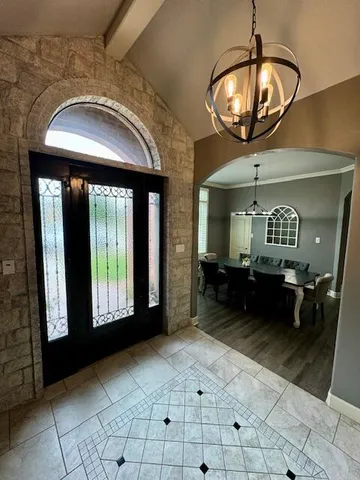 a view of livingroom with furniture and chandelier