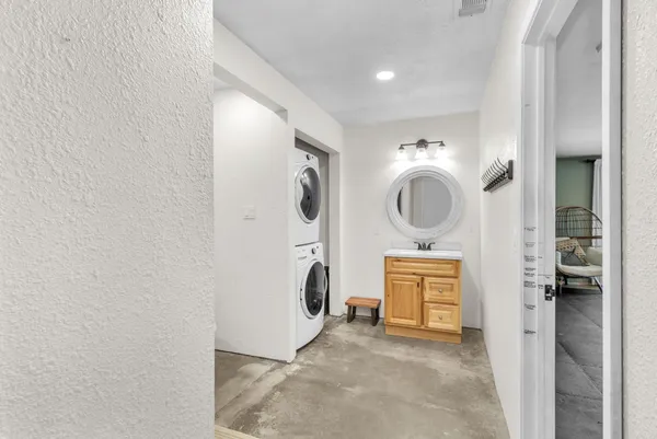 a view of a storage and utility room in a laundry room