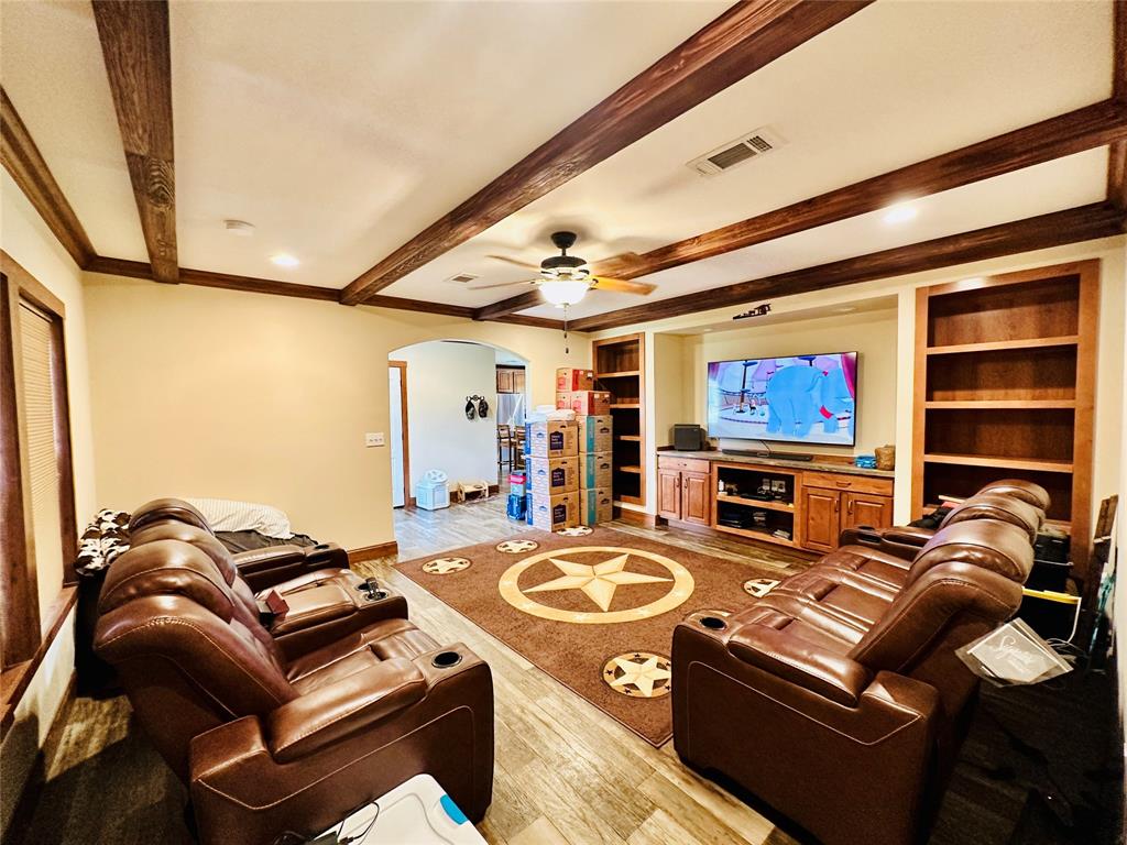 251 County Road 225 Rising Star, TX 76471 - Photo 16 of 40 a living room with furniture and a flat screen tv