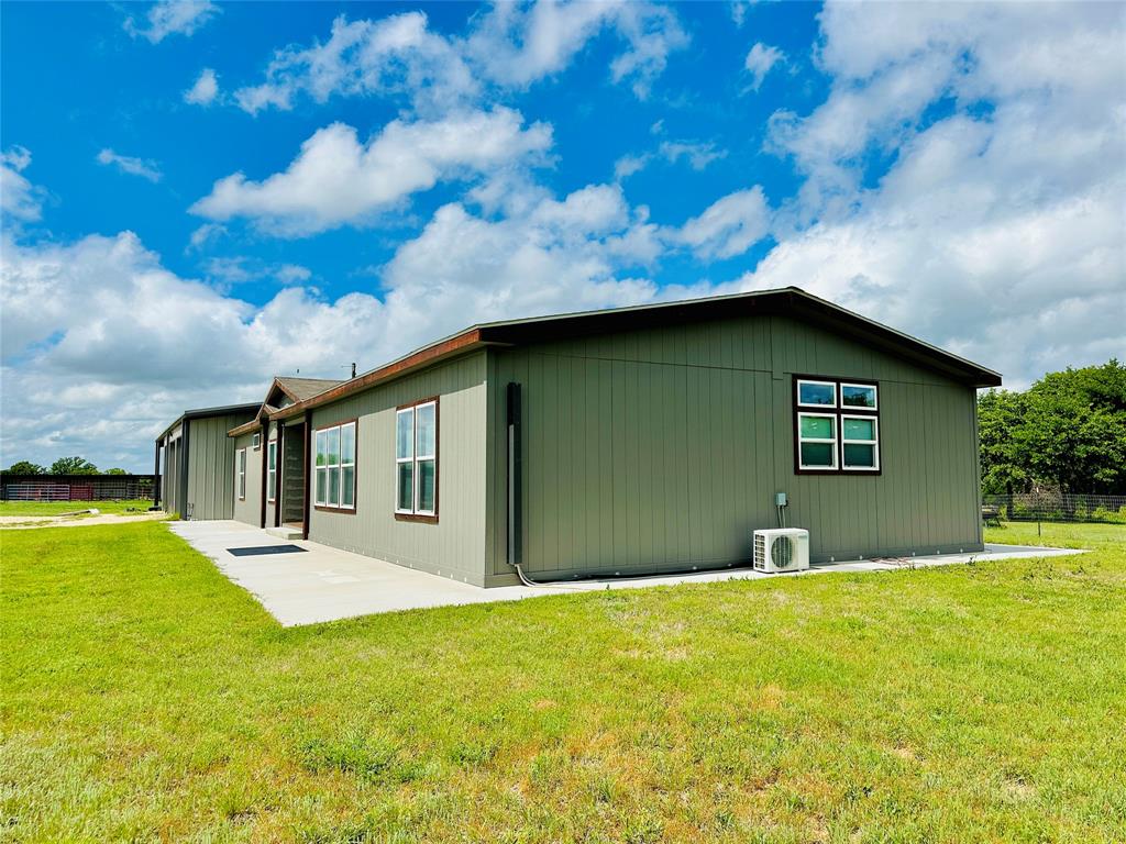 251 County Road 225 Rising Star, TX 76471 - Photo 2 of 40 a house view with swimming pool in front of it
