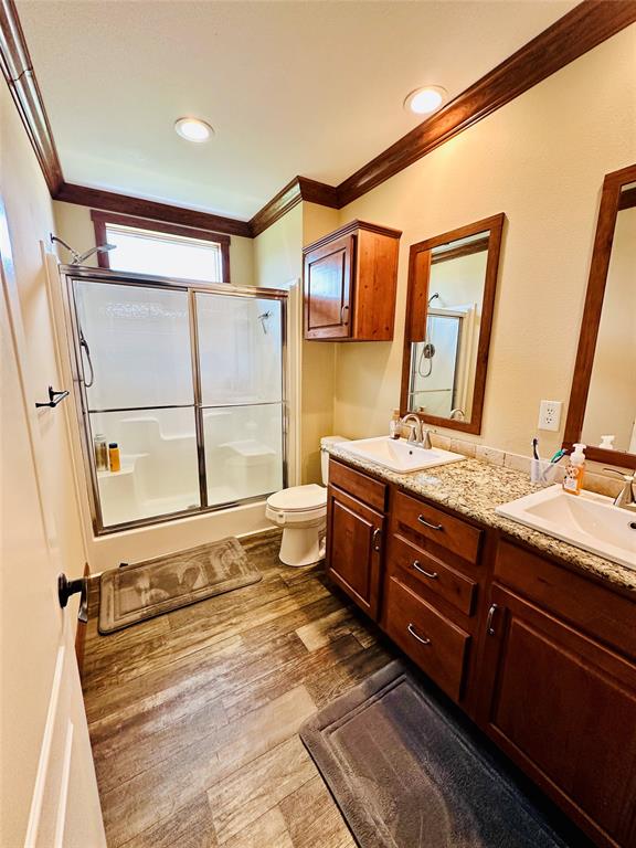 251 County Road 225 Rising Star, TX 76471 - Photo 25 of 40 a spacious bathroom with a double vanity sink and a mirror
