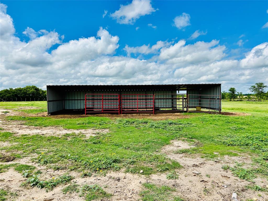 251 County Road 225 Rising Star, TX 76471 - Photo 32 of 40 a view of backyard with barbeque oven and a garden