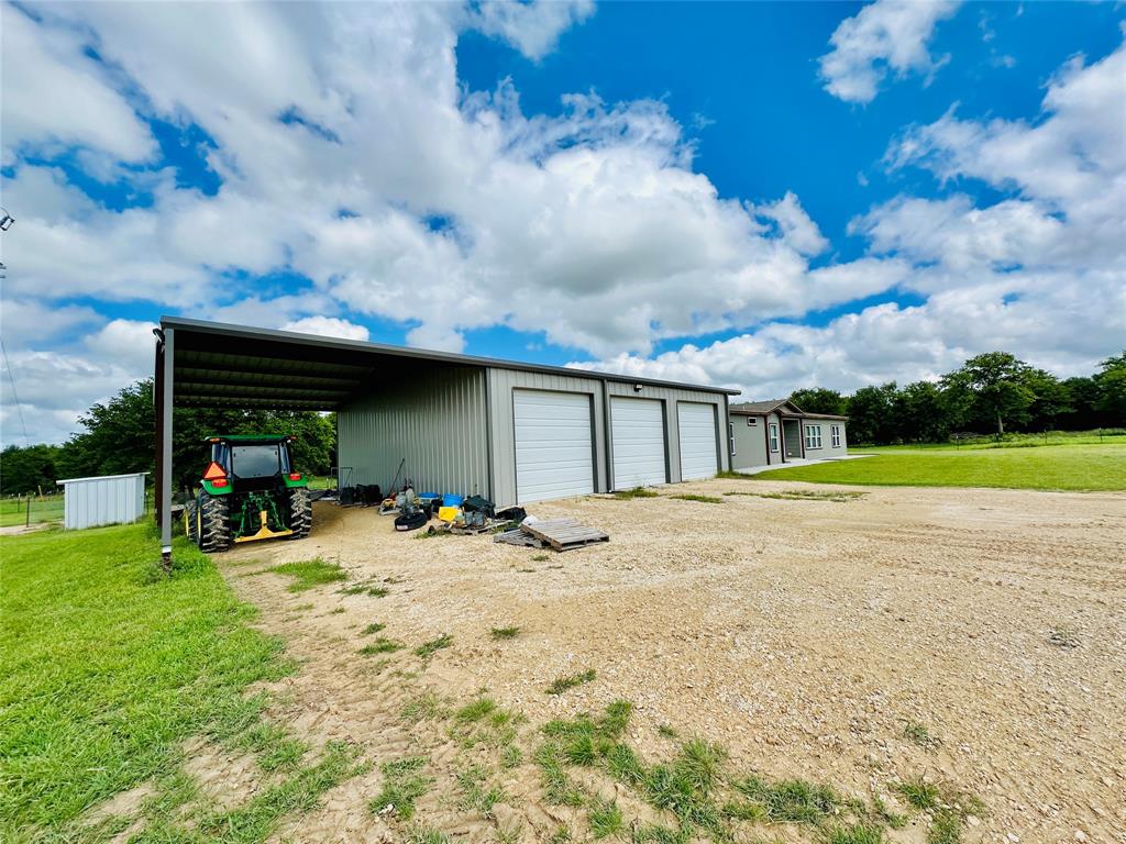 251 County Road 225 Rising Star, TX 76471 - Photo 8 of 40 a view of a house with backyard and sitting area