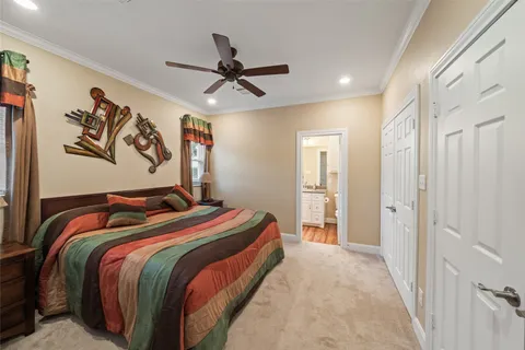 a bedroom with a bed and a television