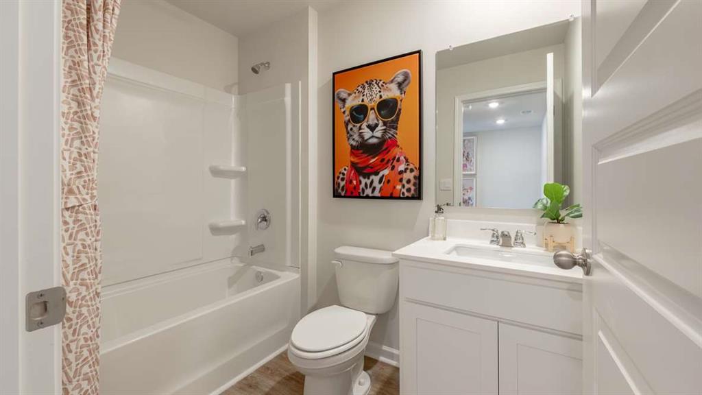 2080 Moss Hill Road Stone Mountain, GA 30083 - Photo 23 of 31 a bathroom with a sink a toilet and shower