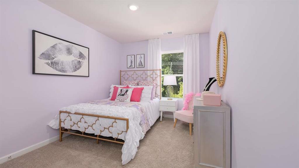 2080 Moss Hill Road Stone Mountain, GA 30083 - Photo 25 of 31 a bedroom with a bed and a painting on the wall