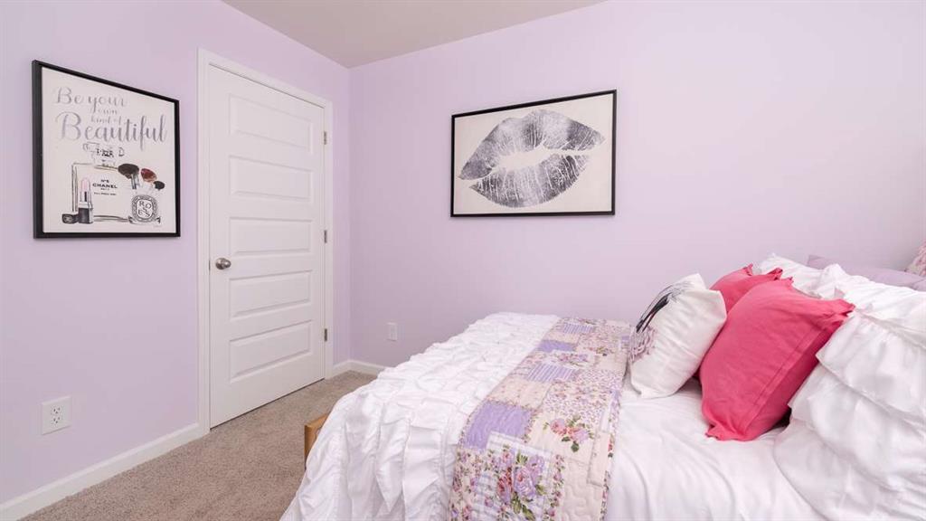 2080 Moss Hill Road Stone Mountain, GA 30083 - Photo 27 of 31 a bedroom with a bed and a painting on the wall