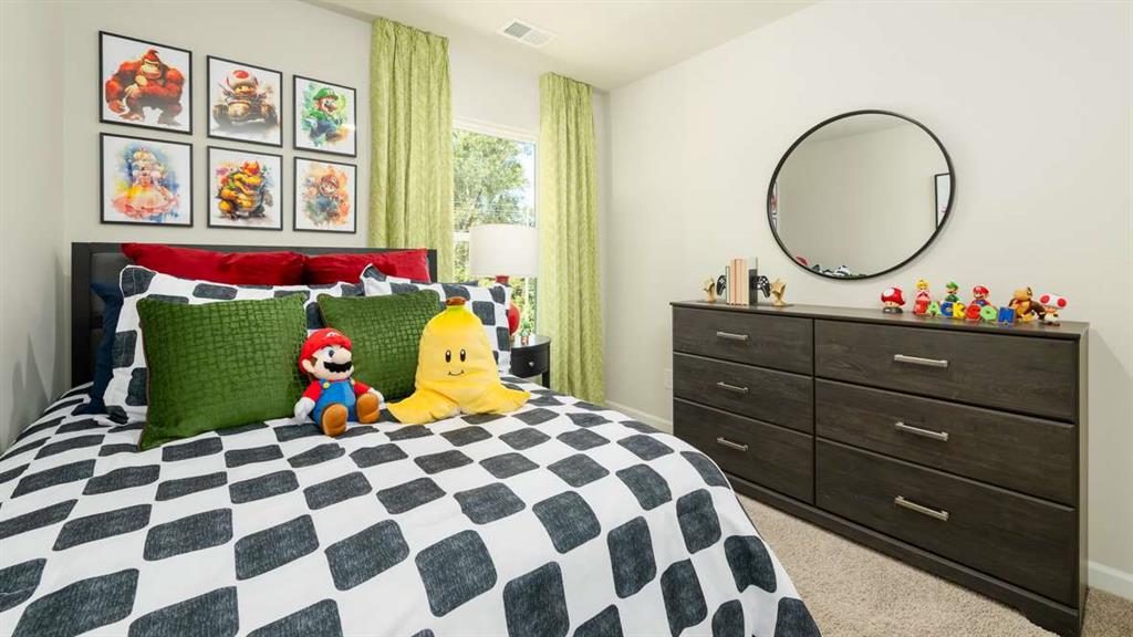 2080 Moss Hill Road Stone Mountain, GA 30083 - Photo 28 of 31 a bed room with a bed and a painting on the wall