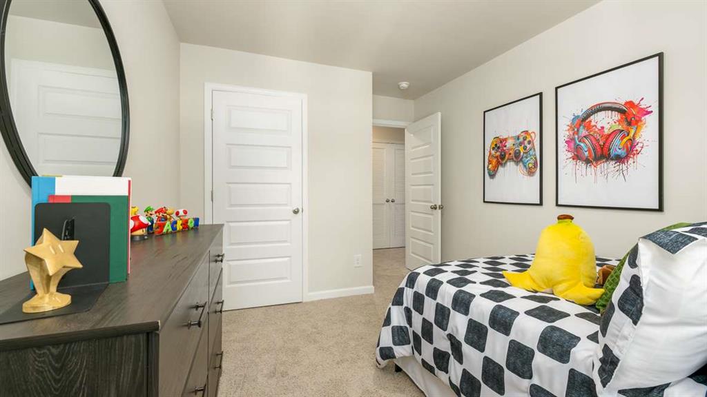 2080 Moss Hill Road Stone Mountain, GA 30083 - Photo 29 of 31 a bedroom with a bed and wooden floor