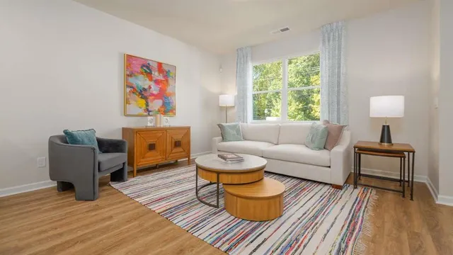 a living room with furniture and a window
