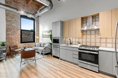 a kitchen with stainless steel appliances granite countertop a stove and a sink