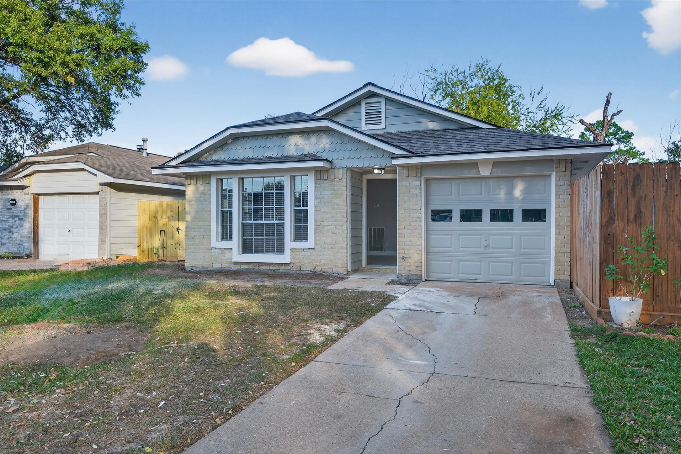 11046 Rainbow Glen Drive Houston, TX 77064 - Photo 1 of 17 a front view of a house with garden