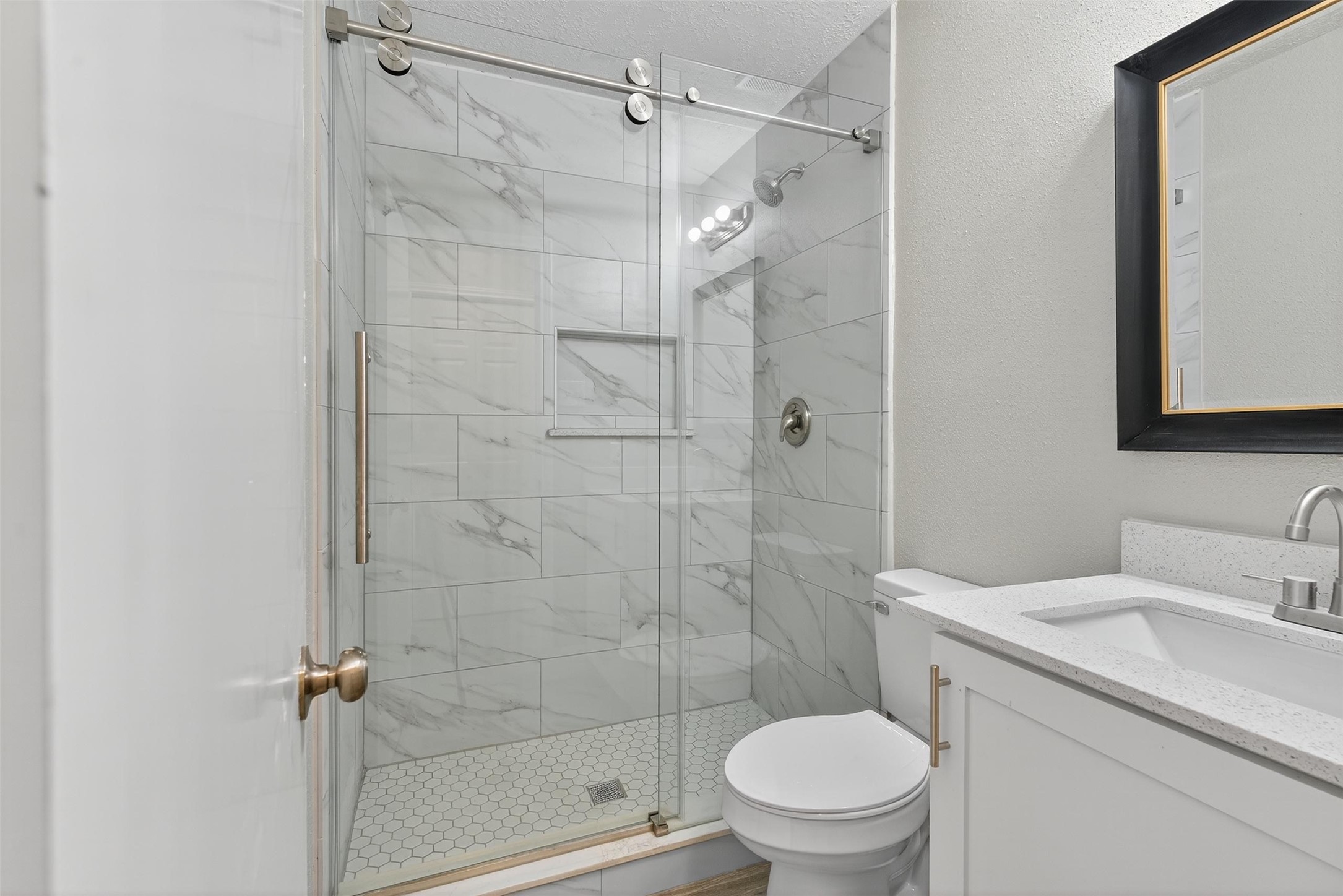 11046 Rainbow Glen Drive Houston, TX 77064 - Photo 14 of 17 a bathroom with a sink toilet and shower
