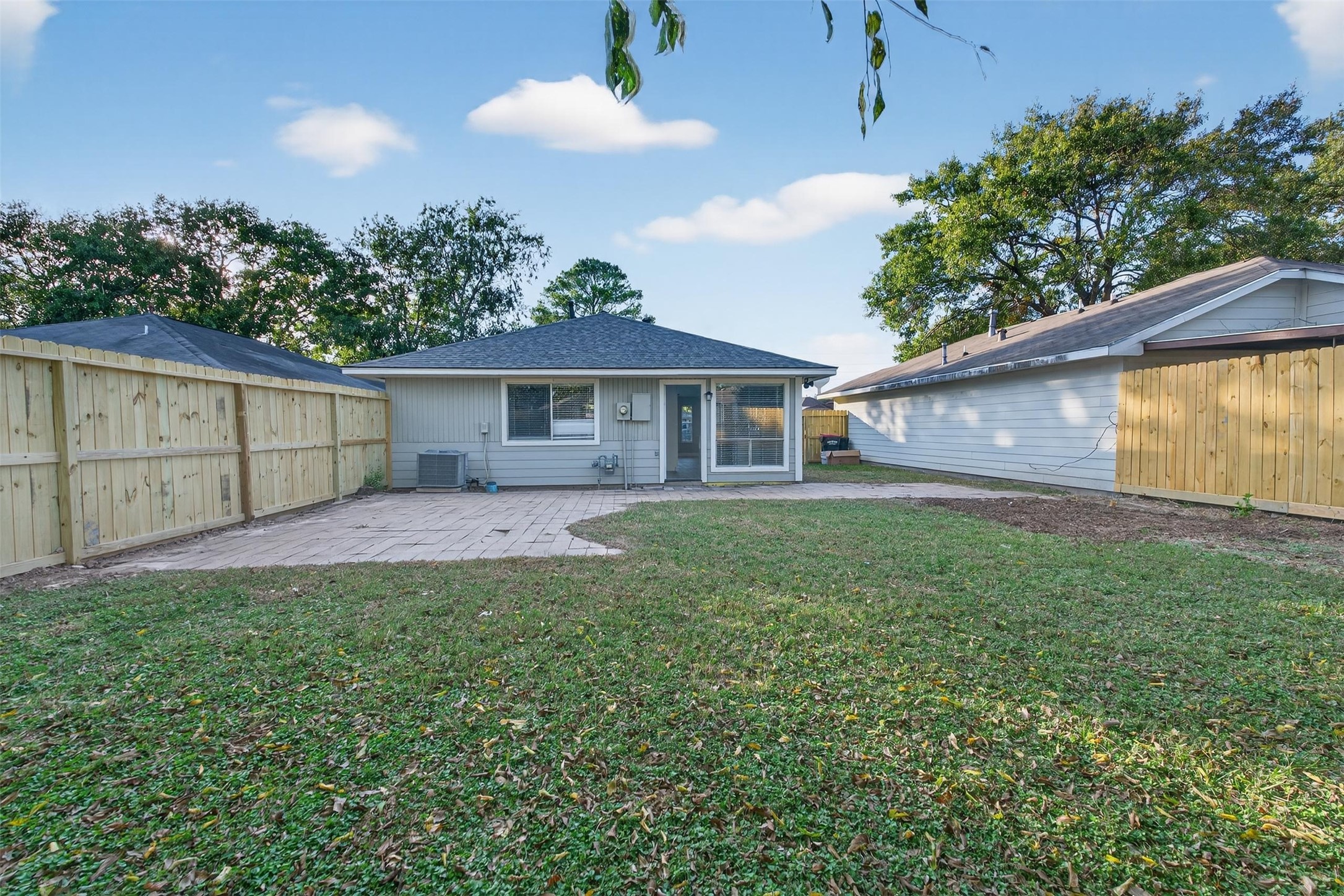 11046 Rainbow Glen Drive Houston, TX 77064 - Photo 16 of 17 a view of backyard with a garden and plants
