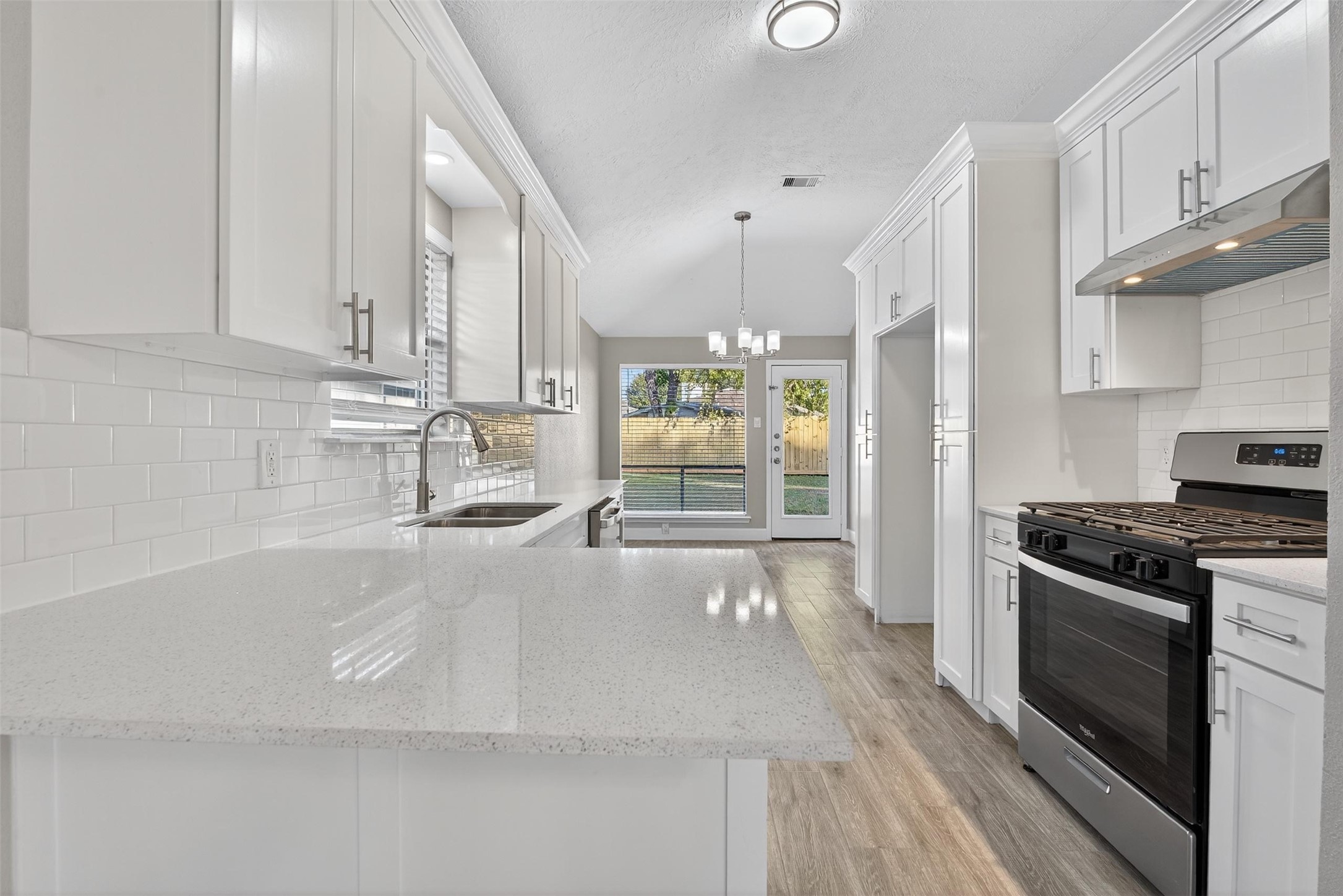 11046 Rainbow Glen Drive Houston, TX 77064 - Photo 6 of 17 a kitchen with stainless steel appliances granite countertop a stove a sink and a refrigerator