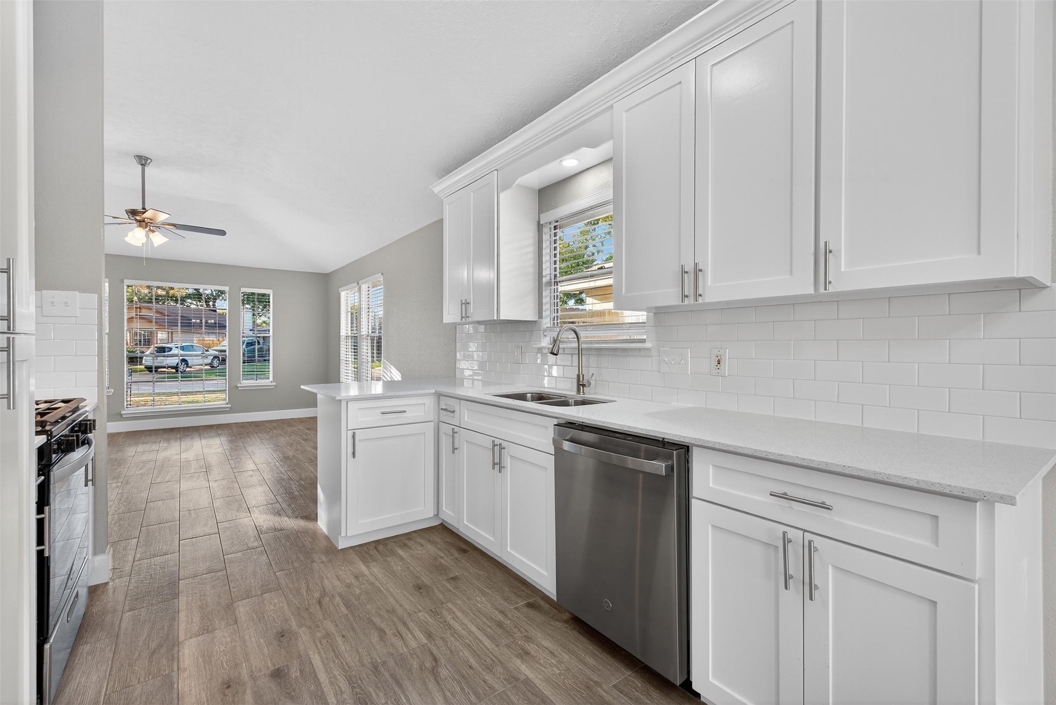 11046 Rainbow Glen Drive Houston, TX 77064 - Photo 7 of 17 a kitchen with a sink cabinets and window