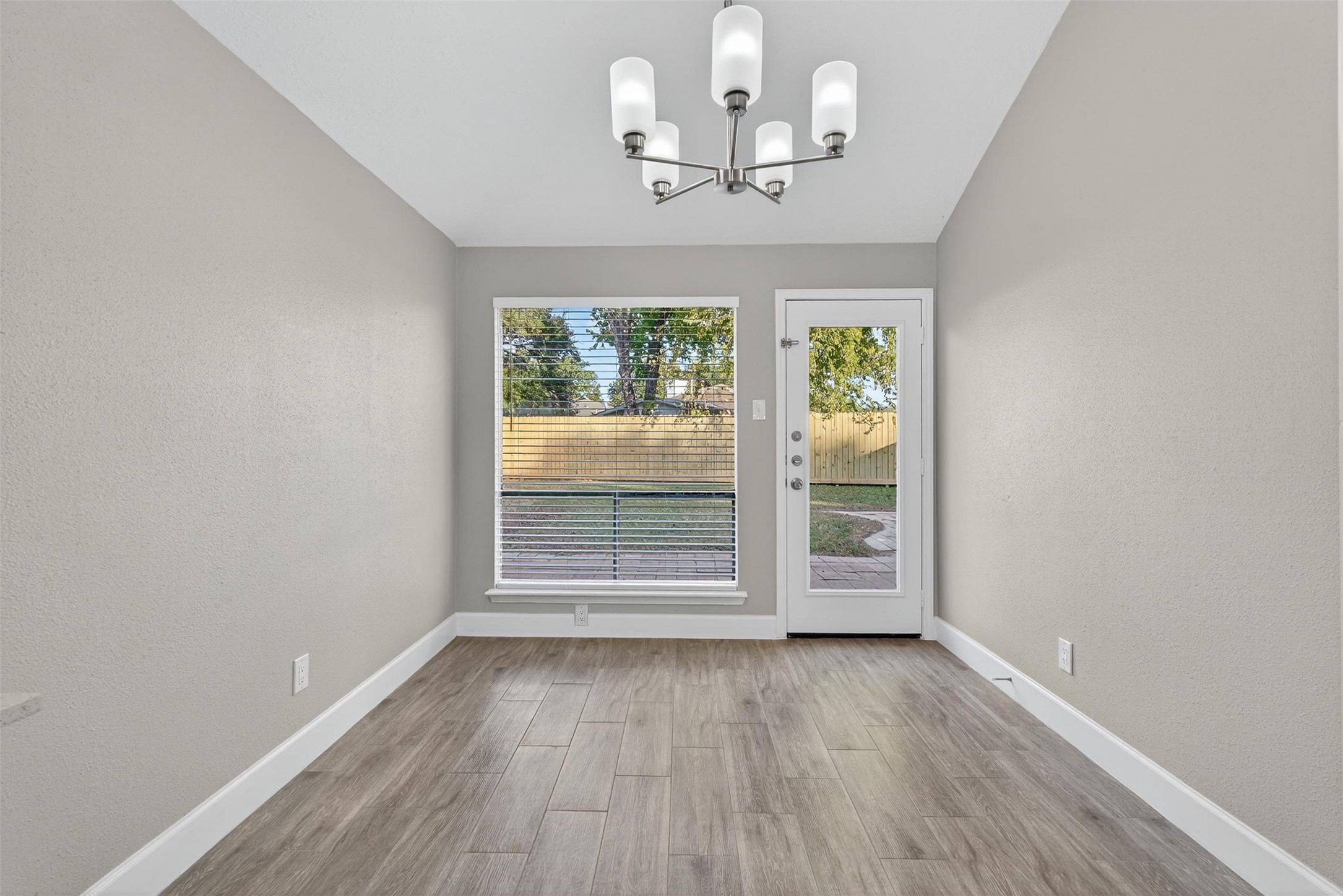 11046 Rainbow Glen Drive Houston, TX 77064 - Photo 9 of 17 wooden floor in an empty room with a window
