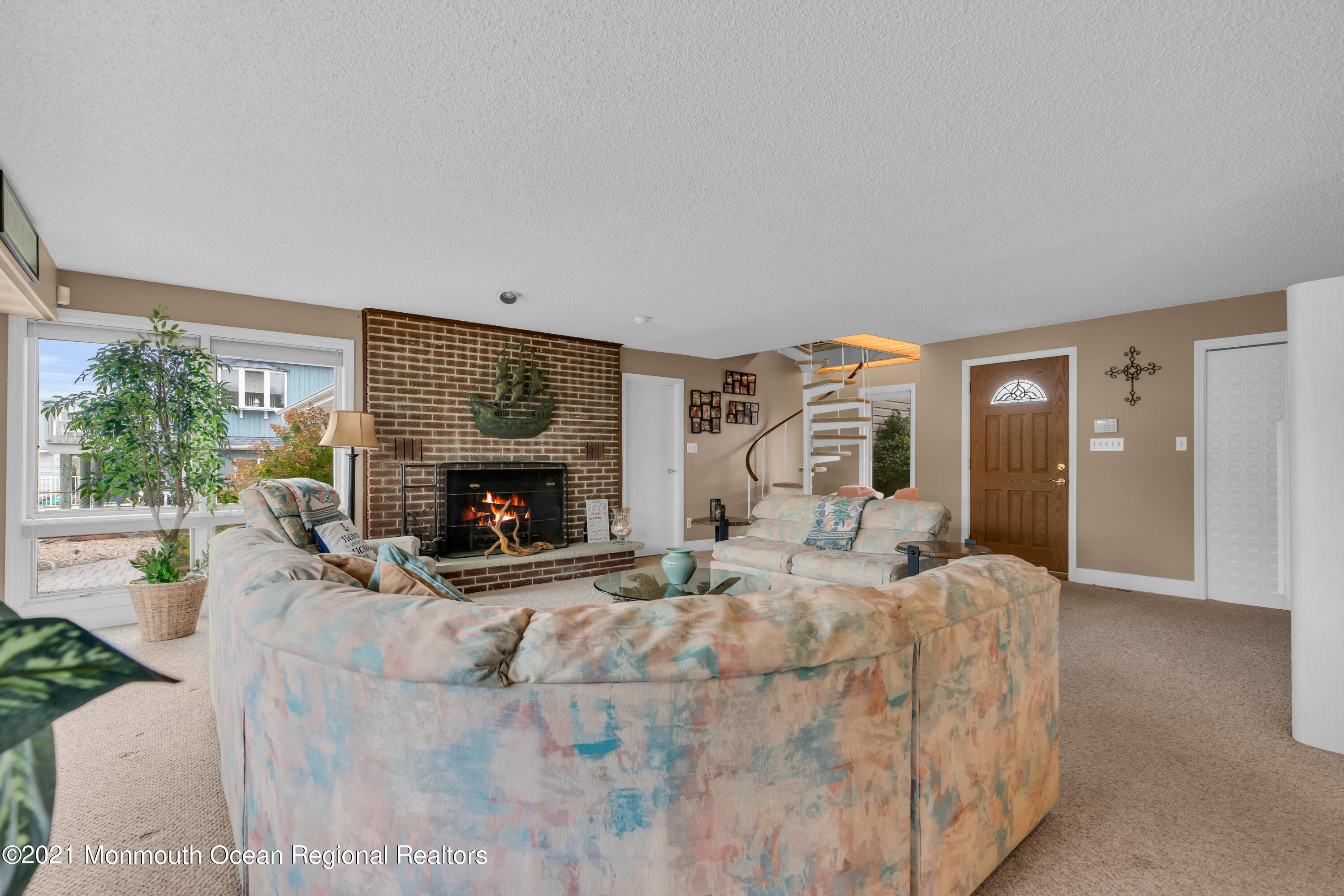 59 Cedar Run Road Bayville, NJ 08721 - Photo 14 of 32 a living room with furniture a fireplace and a table