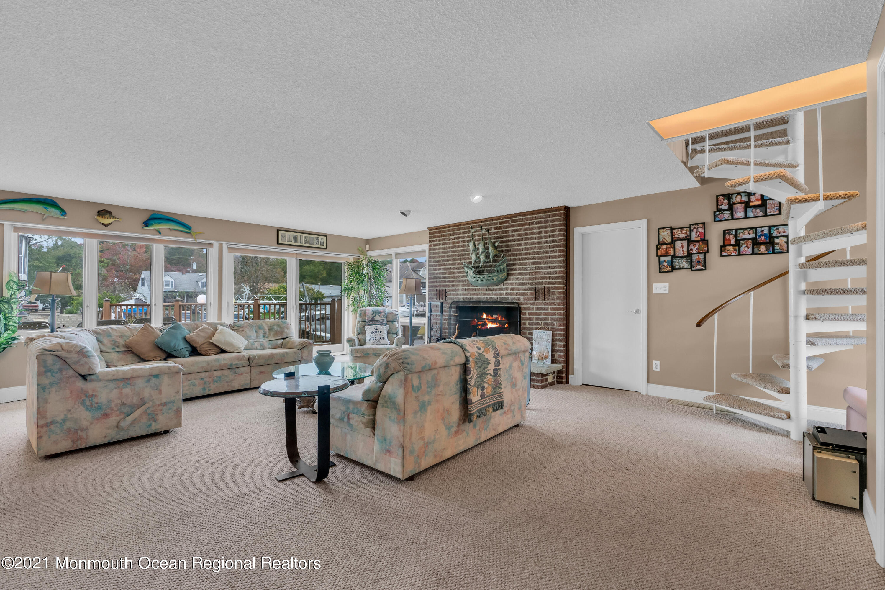 59 Cedar Run Road Bayville, NJ 08721 - Photo 15 of 32 a living room with furniture and a floor to ceiling window