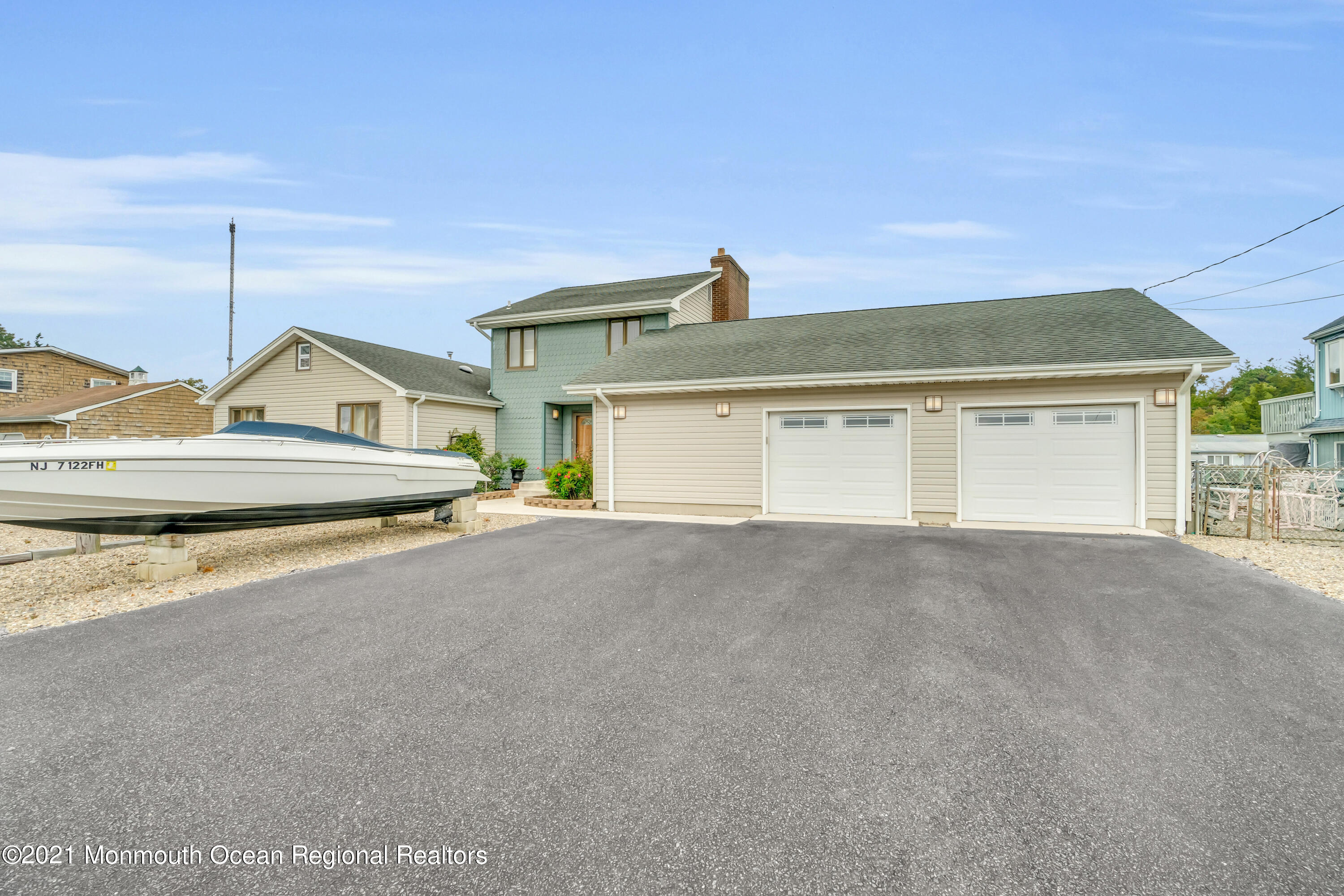 59 Cedar Run Road Bayville, NJ 08721 - Photo 4 of 32 a view of an house with backyard and parking