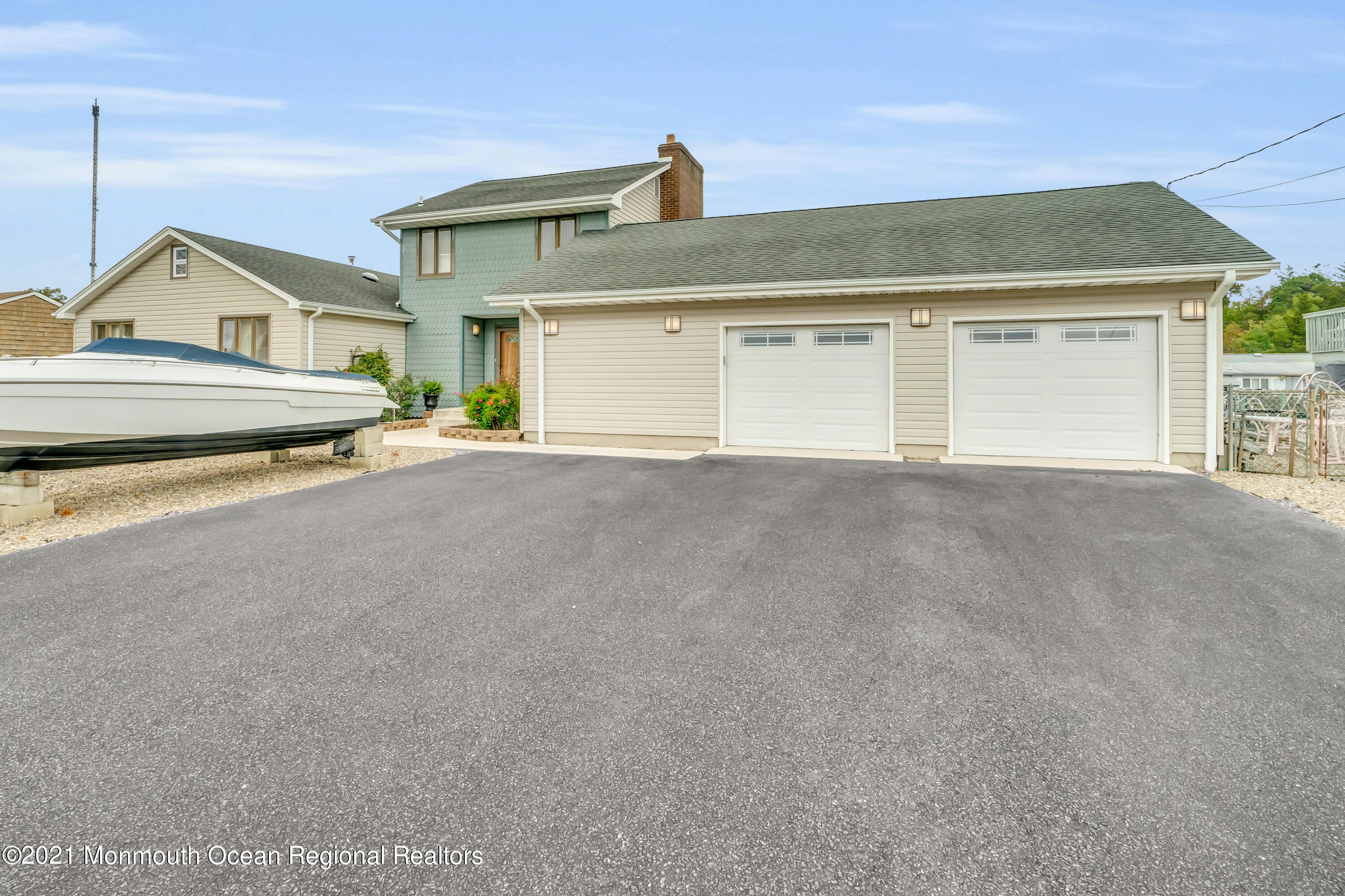 59 Cedar Run Road Bayville, NJ 08721 - Photo 5 of 32 a view of a house with a garage and a garage