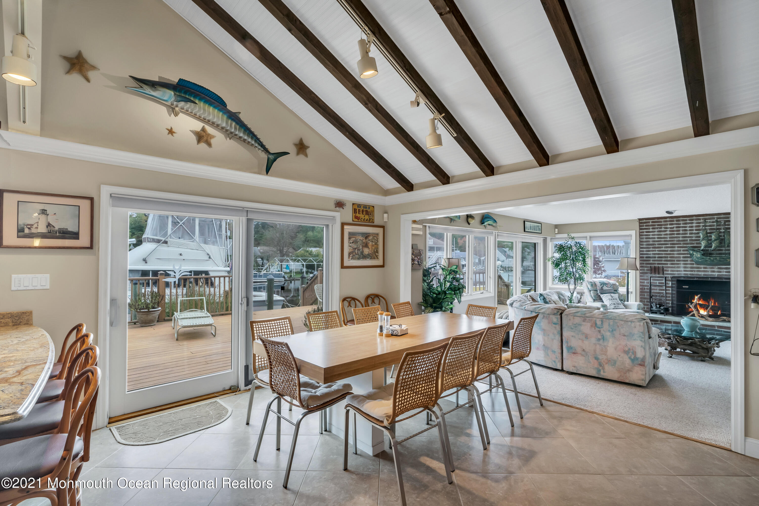 59 Cedar Run Road Bayville, NJ 08721 - Photo 8 of 32 a dining room with furniture large windows and a chandelier