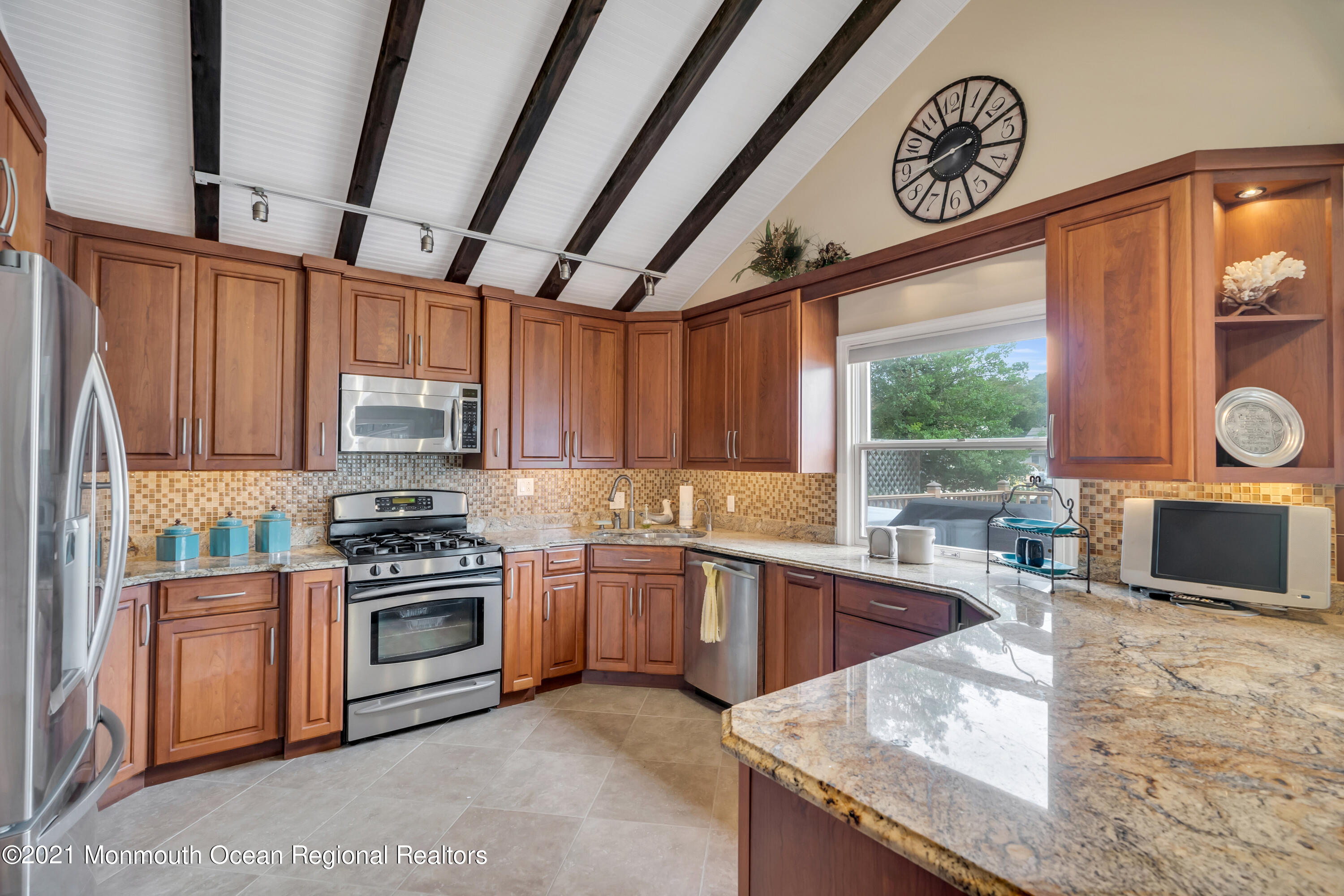 59 Cedar Run Road Bayville, NJ 08721 - Photo 9 of 32 a kitchen with stainless steel appliances granite countertop a sink a stove and a wooden floors