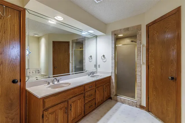 a bathroom with a double vanity sink mirror and double