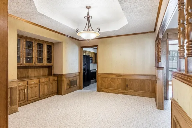 a spacious bathroom with a granite countertop sink a mirror and a bathtub
