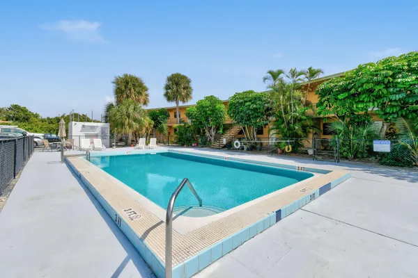 a view of a swimming pool with a patio