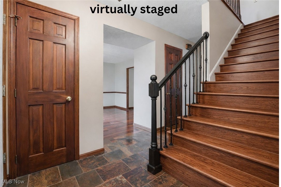 11710 Butternut Road Chardon, OH 44024 - Photo 21 of 48 Virtually staged for inspiration Stairs featuring baseboards and stone finish flooring