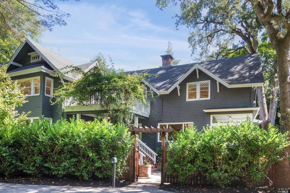 a view of a house with a yard and plants