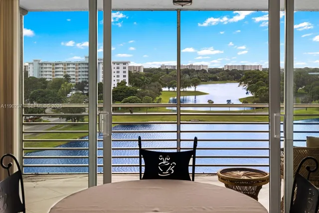 a kitchen with granite countertop cabinets stainless steel appliances and a counter space