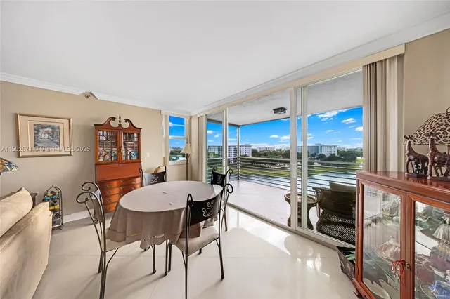 a view of a dining room with furniture window and outside view
