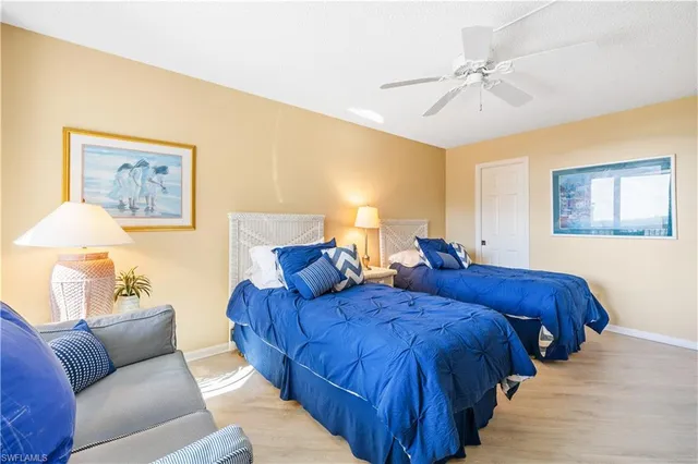 a bedroom with furniture and painting on the wall